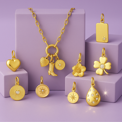 Collection of gold jewelry including necklaces and pendants on a purple background