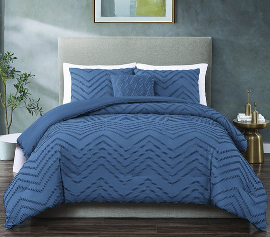 Beyond the Basics - blue clipped jacquard queen comforter set styled on a bed